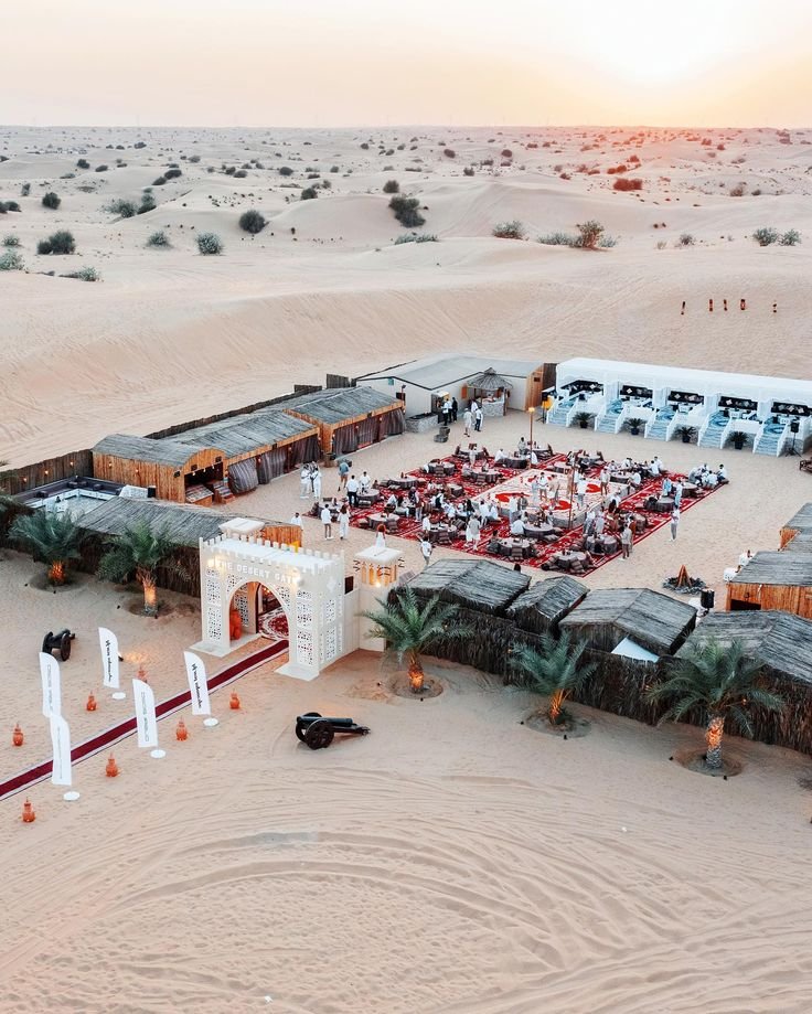Aerial view of the Al Khatim desert camp at dusk